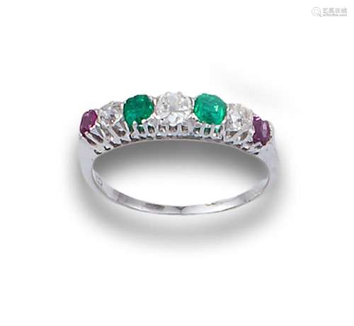 18kt white gold with diamonds, emeralds, sapphires.