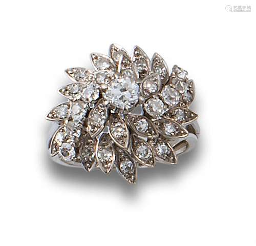 Flower ring, 1950s, in platinum, formed by leaves.