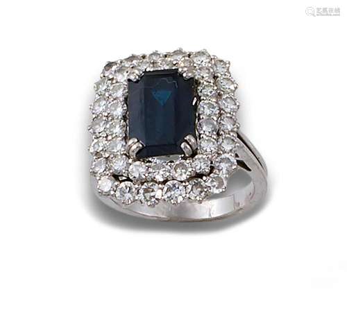 18kt white gold ring with emerald-cut sapphire and brilliant...