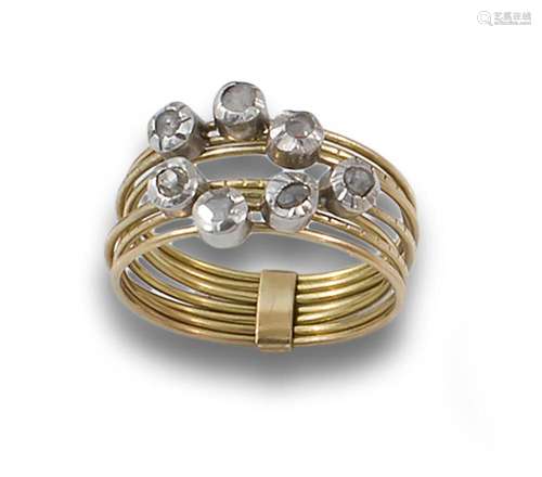 18kt yellow and white gold ring. Detailed with rose-cut diam...