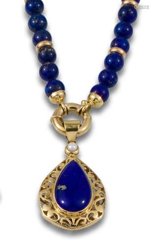 Necklace made of lapis lazuli beads,interspersed with 18kt y...