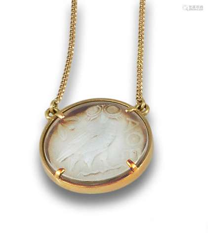 18kt yellow gold frame pendant with a rock crystal.