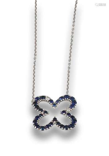 18kt white gold openwork flower pendant, by sapphires.