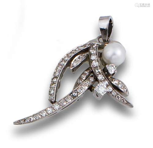 A 1950s brooch pendant in white gold, studded with diamonds ...