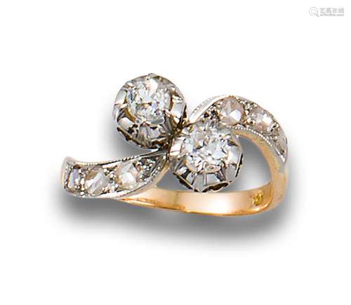 YOU AND I RING, CIRCA 1920, IN DIAMONDS, YELLOW GOLD AND PLA...