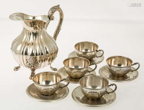 5 silver cups with their plates