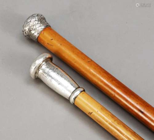 Two walking sticks with silver kno