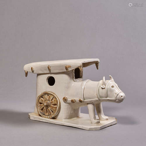 A Chinese White-Glazed Bull and Carriage