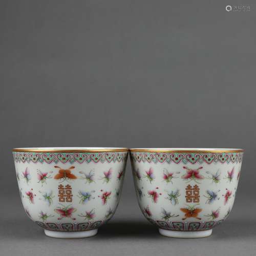 A pair of pink painted golden butterfly cups