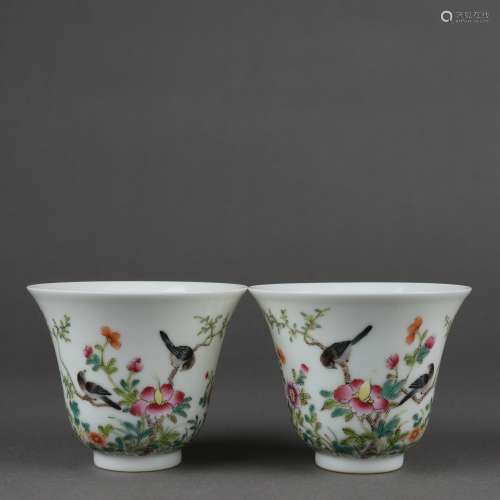 A pair of pink flower and bird pattern cups