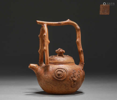 dark-red enameled pottery teapot