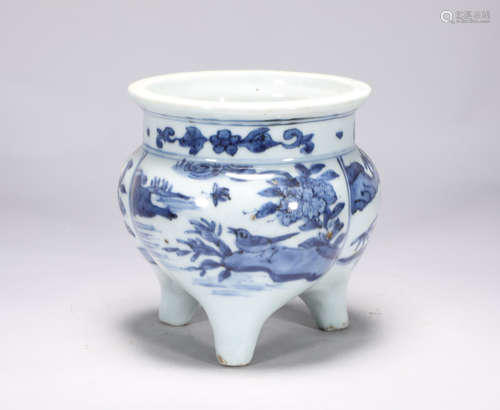 Three legged stove with blue and white flower and bird patte...