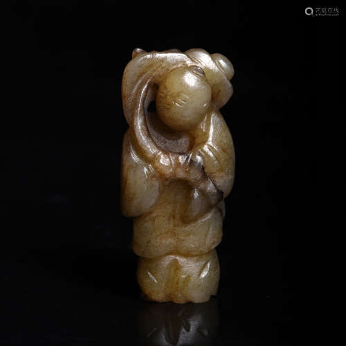 A Carved Jade Figure of Boy and Lotus