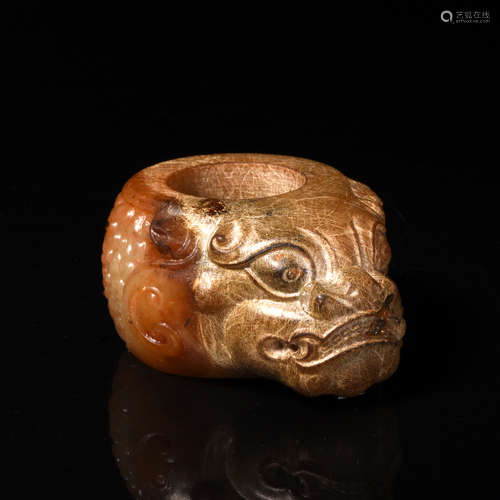 A Carved Brownish Jade Ornament