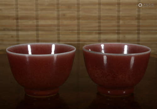 A pair of peachbloom-glazed cup