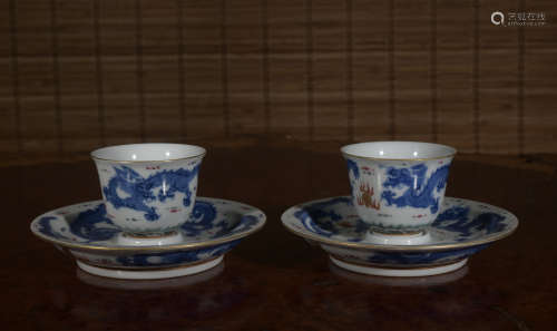 A pair of blue and white 'dragon' cup and holder