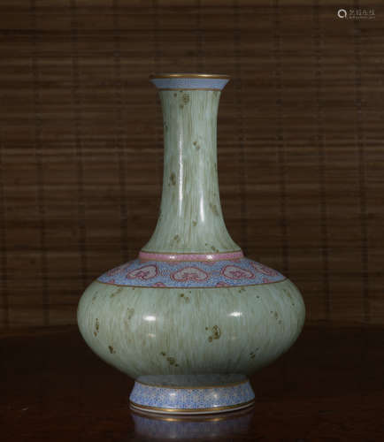 A wooden glazed vase