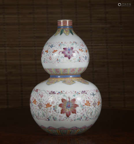 A famille-rose 'floral' gourd-shaped vase