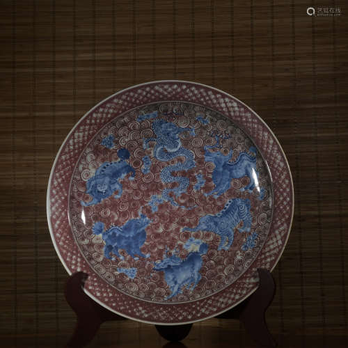 An underglaze-blue and copper-red 'beast' dish