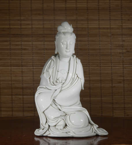 A white glazed statue of Guan yin