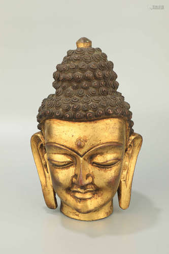 A Bronze Gilt Buddha Head Ornament