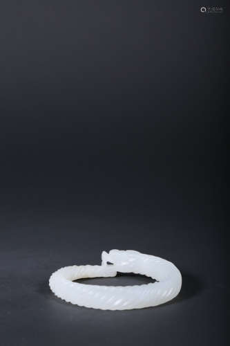 A CARVED WHITE JADE ‘DRAGON’BRACELET,QING DYNASTY