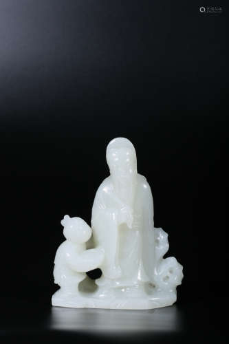 A WHITE JADE ‘RECUMBENT BOY’SCROLL WEIGHT,QING DYNASTY