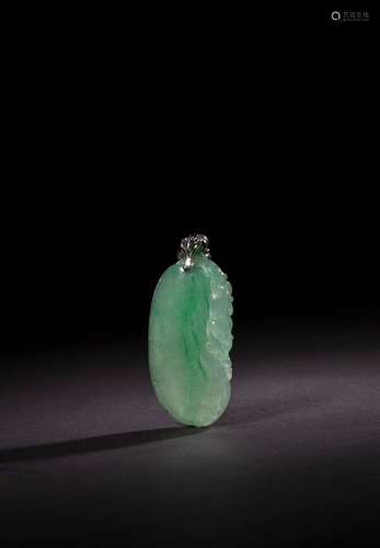 A CARVED JADEITE PENDANT