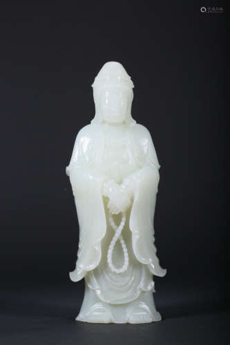 A CARVED WHITE JADE FIGURE OF GUANYIN,QING DYNASTY