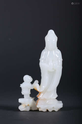 A CARVED WHITE JADE FIGURE OF GUANYIN,QING DYNASTY