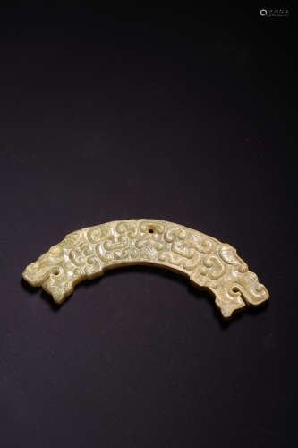 AN ARCHAIC ARC-SHAPED JADE PENDANT,WARRING STATES PERIOD