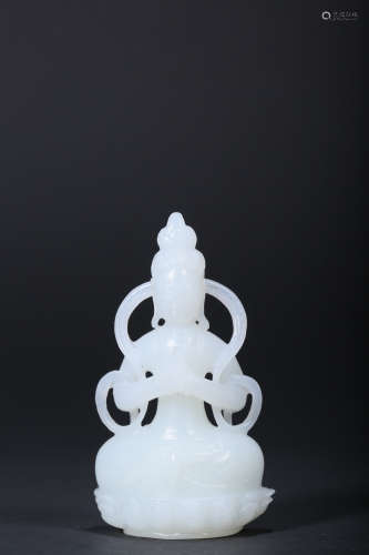 AN ARCHAISTIC CARVED WHITE JADE FIGURE OF GUANYIN,QING DYNAS...