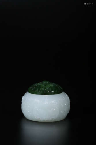 A CARVED WHITE JADE JAR WITH SPINACH-GREEN JADE COVER,QING D...