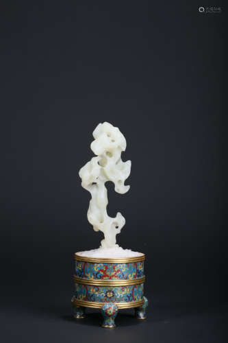 A CARVED WHITE JADE MOUNTAIN WITH A CLOISONNE ENAMEL FOLWERP...