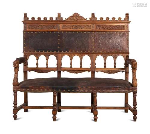 An Austrian Carved Walnut Bench with Tooled Leather Upholste...