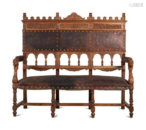 An Austrian Carved Walnut Bench with Tooled Leather Upholste...