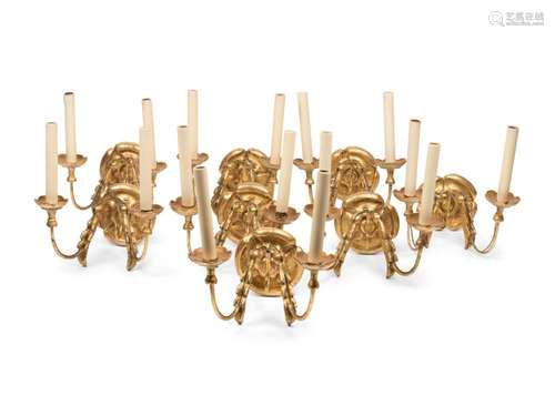 A Set of Eight Continental Giltwood Three-Light Sconces