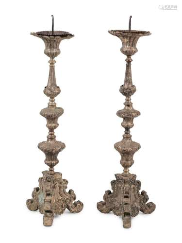 A Pair of Baroque Repousse Decorated Silvered Metal Pricket ...
