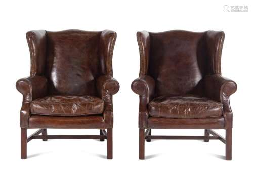 A Pair of Georgian Style Leather Upholstered Wingback Armcha...