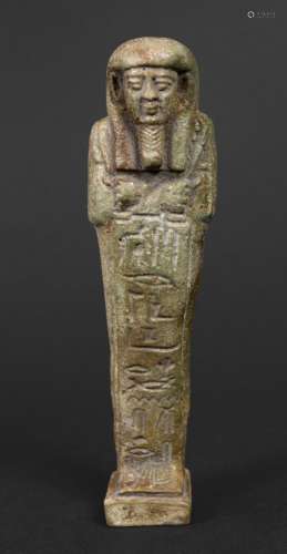 EGYPTIAN SHABTI a green glazed pottery figure of a mummy, wi...