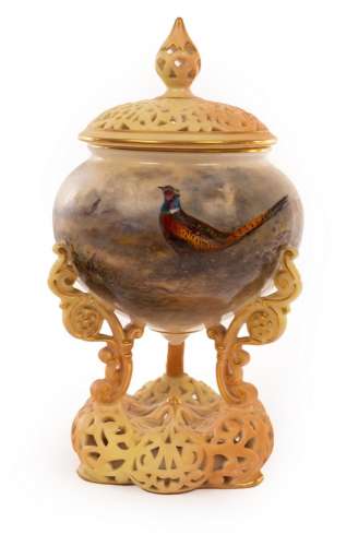 A Royal Worcester pedestal vase painted pheasants in a moorl...