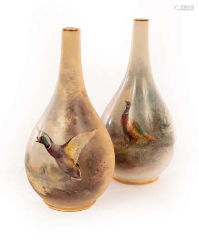 Two Royal Worcester pear-shaped vases with gilt rimmed narro...