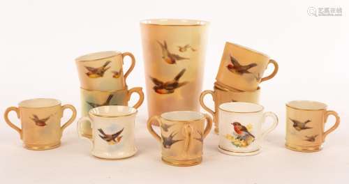 A Royal Worcester miniature loving cup with three handles, p...