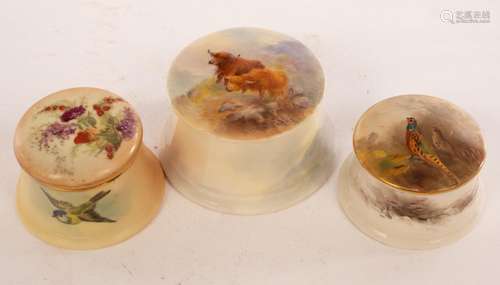 Three Royal Worcester circular boxes and covers, the largest...