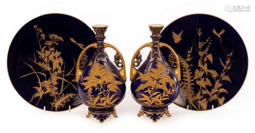 A pair of Royal Worcester pear-shaped vases of dark blue gro...