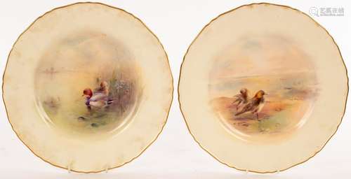 A pair of Royal Worcester plates painted a golden plover and...