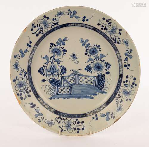 A Delft blue and white charger, possibly London, depicting a...