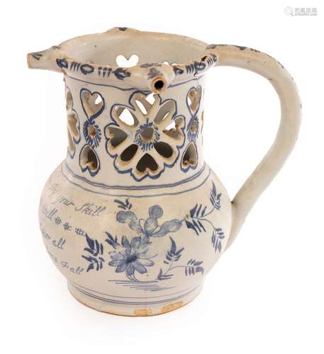 An English Delftware puzzle jug inscribed with a poem,