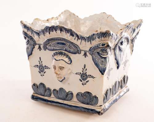 A Delft square planter with moulded mask heads to the sides ...