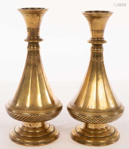 A pair of Mughal bronze tapering vases with circular stepped...